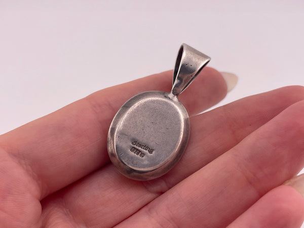 sterling silver synthetic blue swirl stone pendant