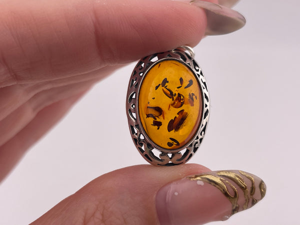 sterling silver amber oval scroll cut-out design pendant