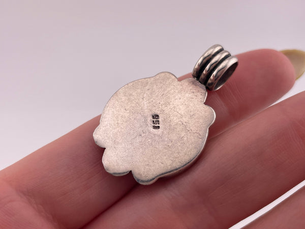 sterling silver bird on tree limb carved material pendant