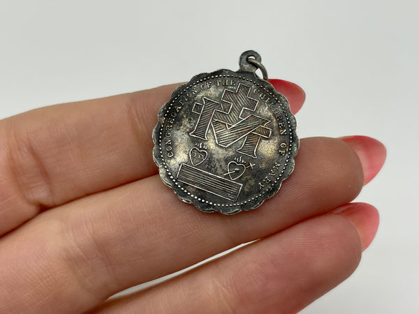 sterling silver religious Mary coin pendant