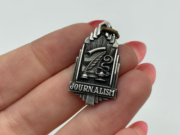 sterling silver 'journalism' dated 1941 pendant