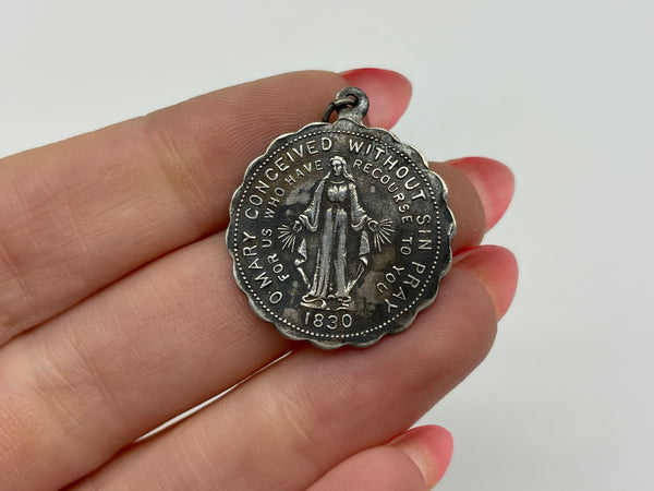sterling silver religious Mary coin pendant